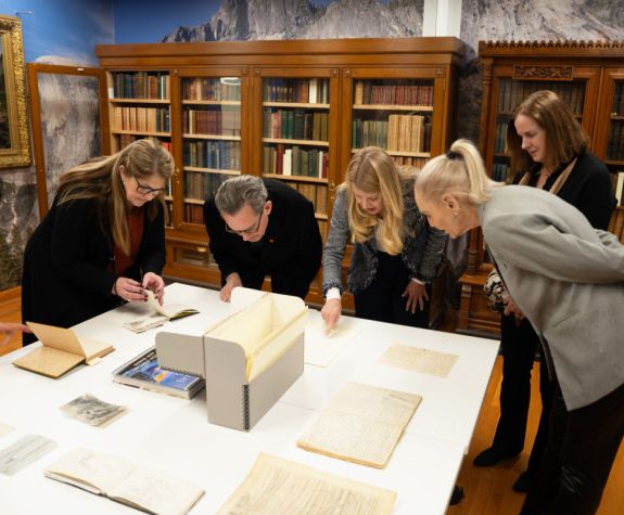 regents look at materials from the library's john muir collection